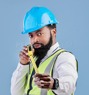 Buy stock photo Black man, portrait and architect with measuring tape for construction against a blue studio background. Face of African male person, engineer or contractor in architecture planning with measure tool