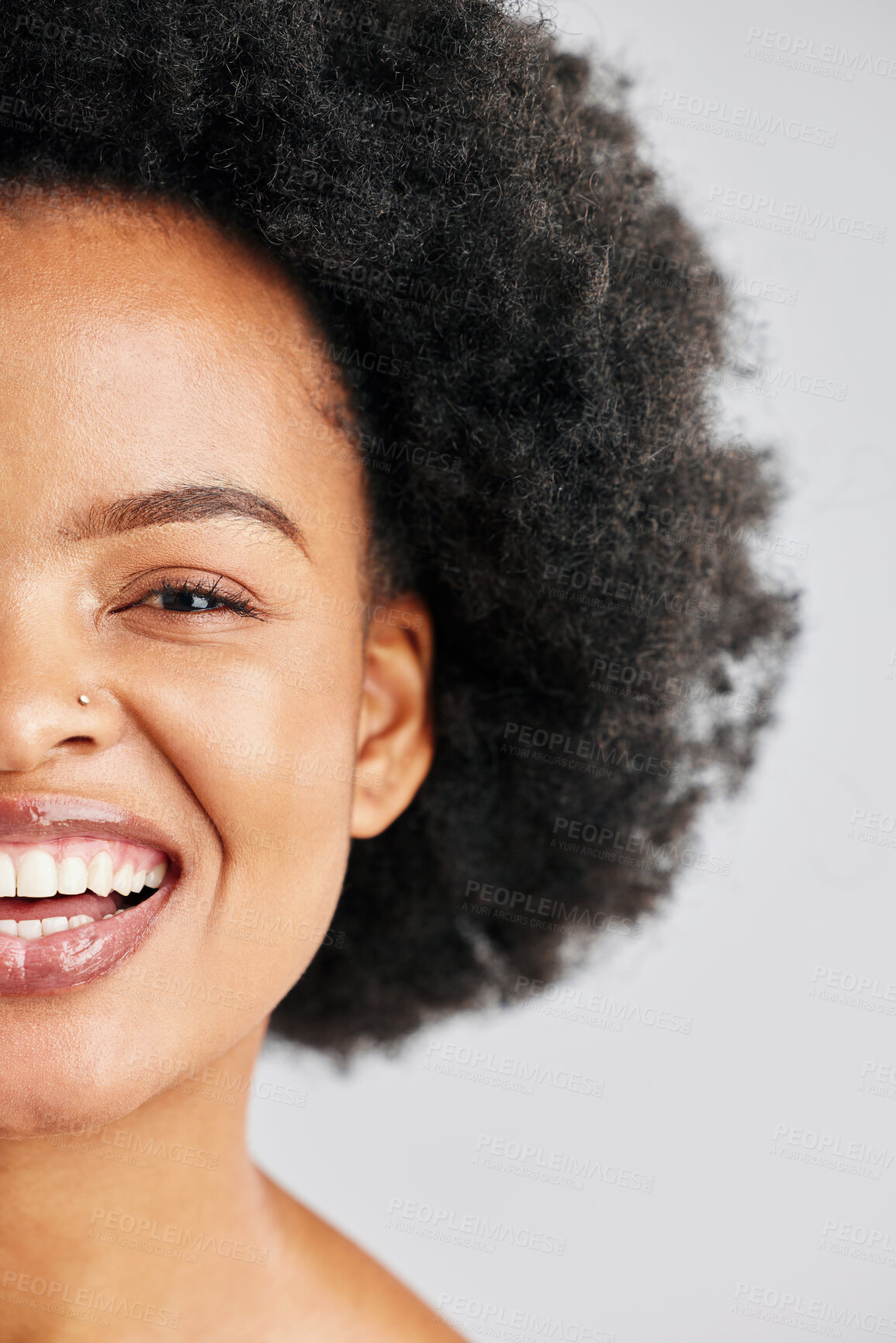 Buy stock photo Skincare portrait, afro and African happy woman with studio beauty, skin cosmetics glow or healthy hair texture. Half face makeup, comedy humour joke and wellness person laughing on white background