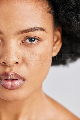 Buy stock photo Beauty, studio portrait and African woman with skincare shine, foundation makeup and natural cosmetics for skin glow. Closeup half face, eye and person with self care wellness on white background