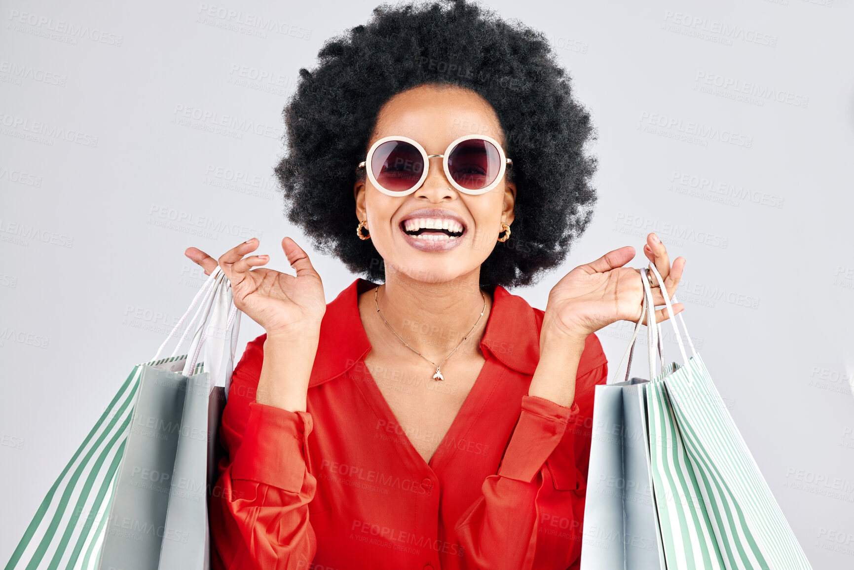 Buy stock photo Happy black woman, face and shopping bags for fashion or style against a white studio background. Portrait of African female person, customer or shopper smile for discount, sale or deal in happiness