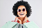 Happy black woman, face and shopping bags for fashion or style against a white studio background. Portrait of African female person, customer or shopper smile for discount, sale or deal in happiness