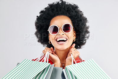 Buy stock photo Happy black woman, face and shopping bags for fashion or style against a white studio background. Portrait of African female person, customer or shopper smile for discount, sale or deal in happiness