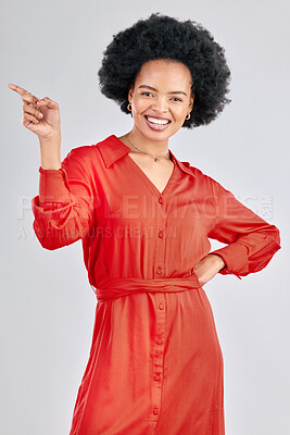 Buy stock photo Pointing, portrait and black woman with a  smile, promotion and presentation against a white studio background. Happy, female person or model with hand gesture, happiness or discount deal with a sale