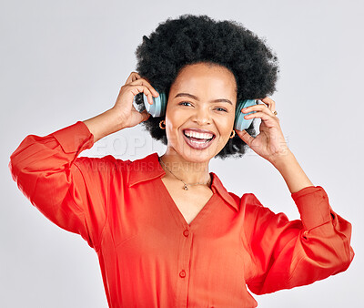 Buy stock photo Portrait, black woman and music headphones in studio for podcast, audio and subscription on white background. Face of happy female model listening to album, streaming sound and hearing song on radio