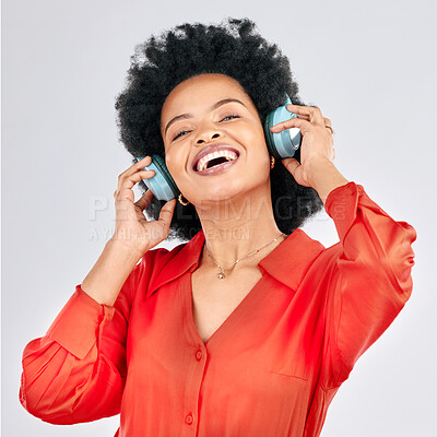 Buy stock photo Music, headphones or happy black woman listening to radio playlist to relax on white background in studio. Hearing, freedom or African person dancing, smiling or streaming a song audio or sound track