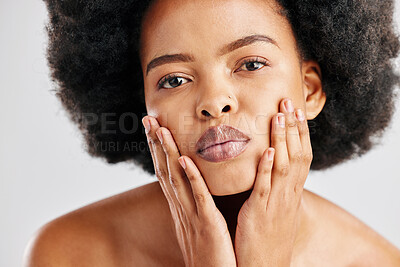 Buy stock photo Portrait, black woman and touch face for skincare, aesthetic glow and soft dermatology on white background. Female model, natural beauty and afro hair in studio for shine, healthy facial or self care