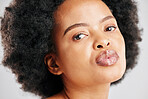 Skin care, beauty and portrait of a black woman with dermatology, cosmetics or natural makeup. Closeup and face of serious African female model in studio for facial glow, self love and afro hair