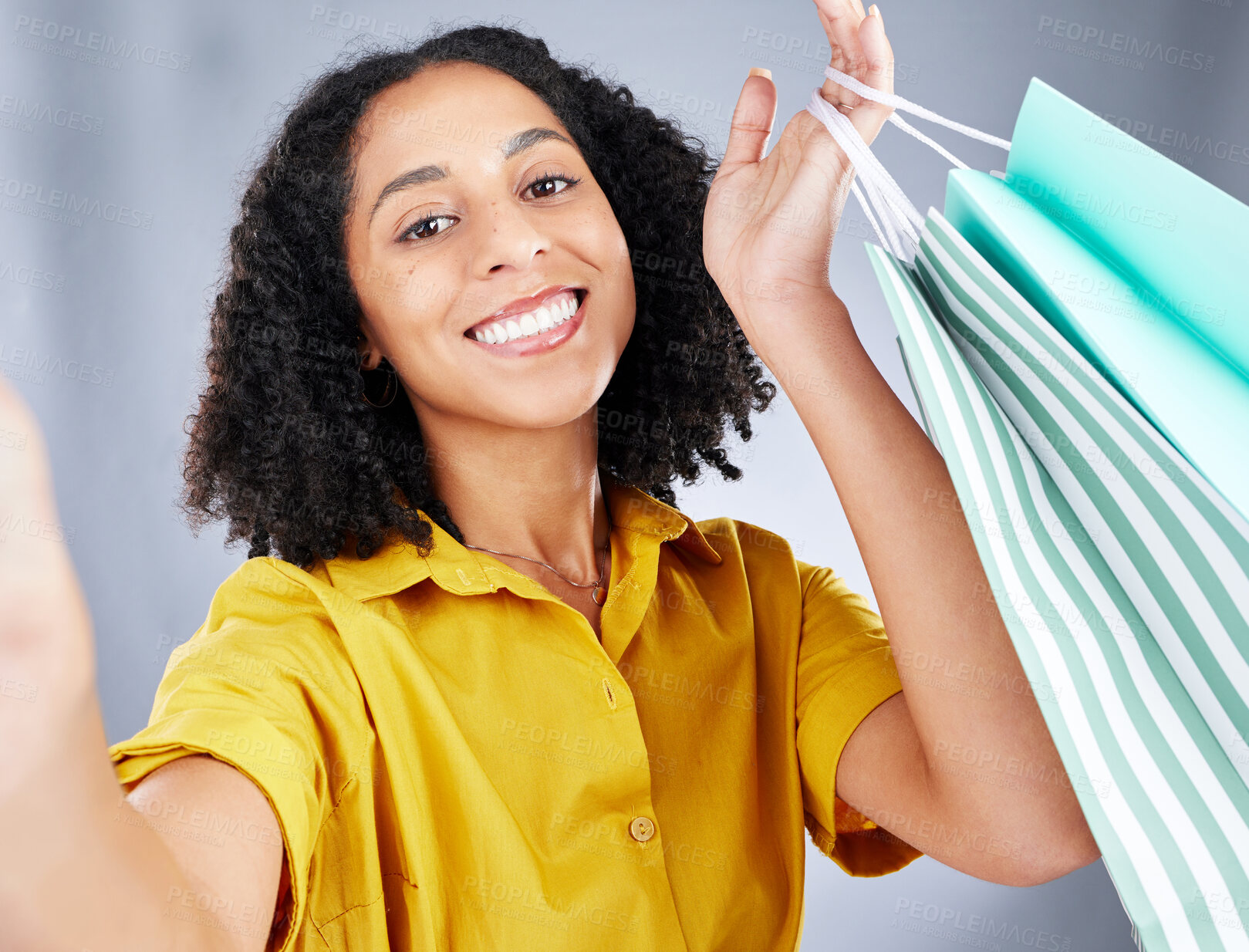 Buy stock photo Shopping bag, selfie and woman in portrait for discount, sale and happy on white background. Retail, face and fashion influencer, african person or customer with profile picture photography in studio