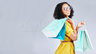 Buy stock photo Woman, shopping and excited with bags at retail sale, promotion or happy for discount on studio, mockup or background. Customer, portrait and shop for fashion or sales on luxury clothing