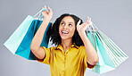 Thinking, shopping bag and a woman in studio for fashion sale, promotion or retail discount. Excited female model or happy customer on a white background advertising commerce offer, deal or gift 