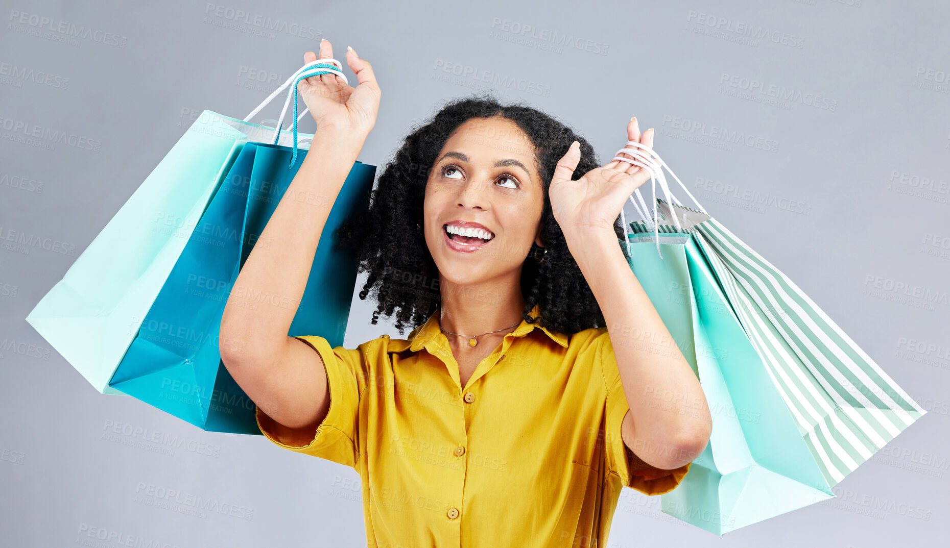 Buy stock photo Thinking, shopping bag and a woman in studio for fashion sale, promotion or retail discount. Excited female model or happy customer on a white background advertising commerce offer, deal or gift 