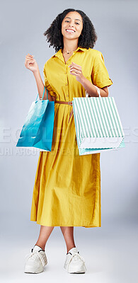 Buy stock photo Portrait, shopping bag and a woman in studio for fashion sale, promotion or retail discount. African female model or happy customer on a white background for advertising commerce offer, deal or gift 