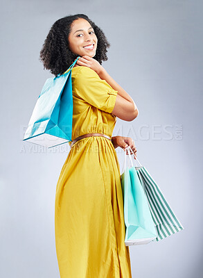 Buy stock photo Shopping bag, fashion and young woman for happy discount, sale and retail promotion on a white background. Winning gift, giveaway and customer, model or african person in clothes portrait and studio