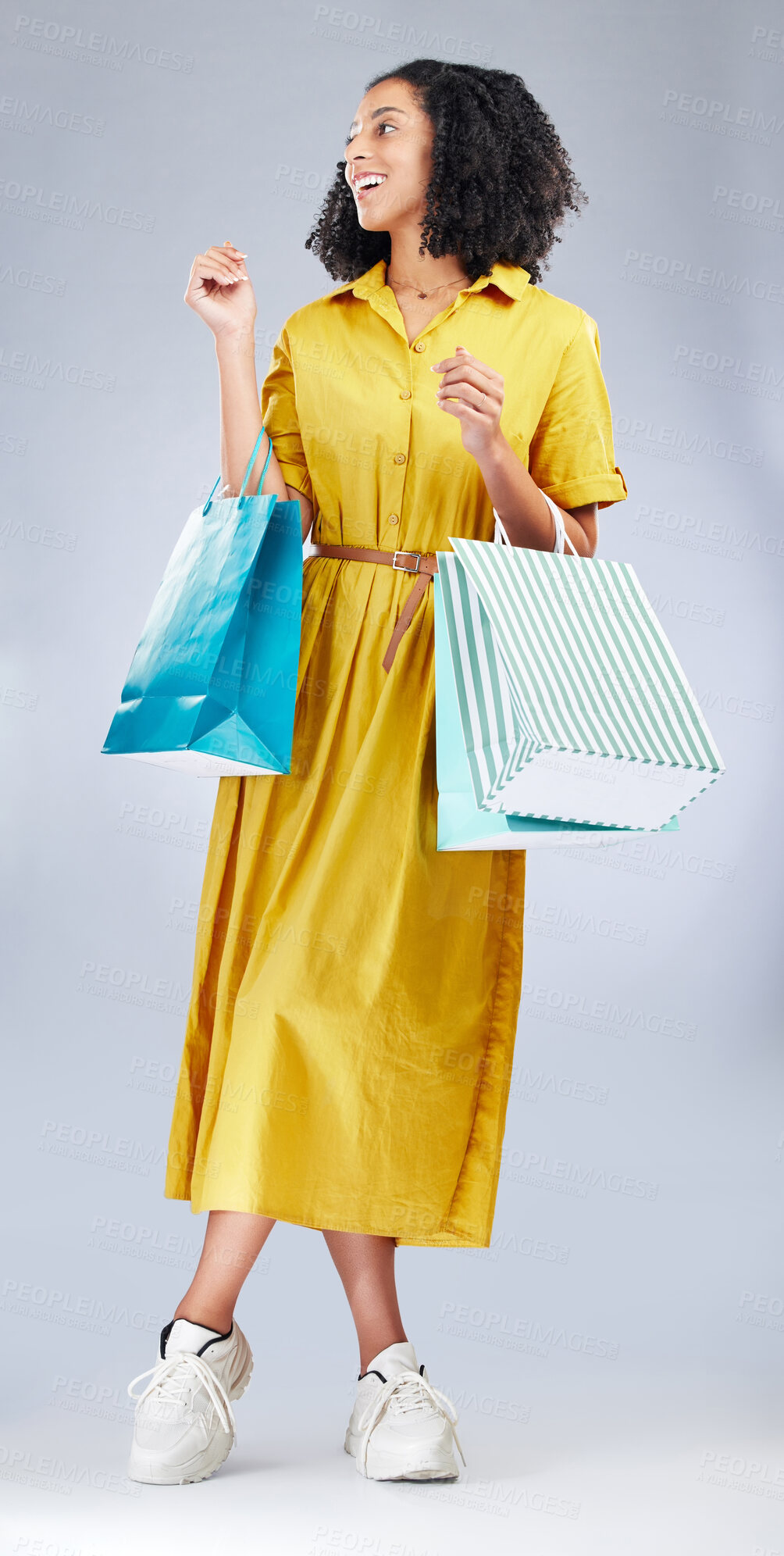 Buy stock photo Thinking, smile and woman with shopping bag for fashion in studio isolated on a white background. Happy, sales and African customer with gift, discount deal or clothes from shop, mall or retail store