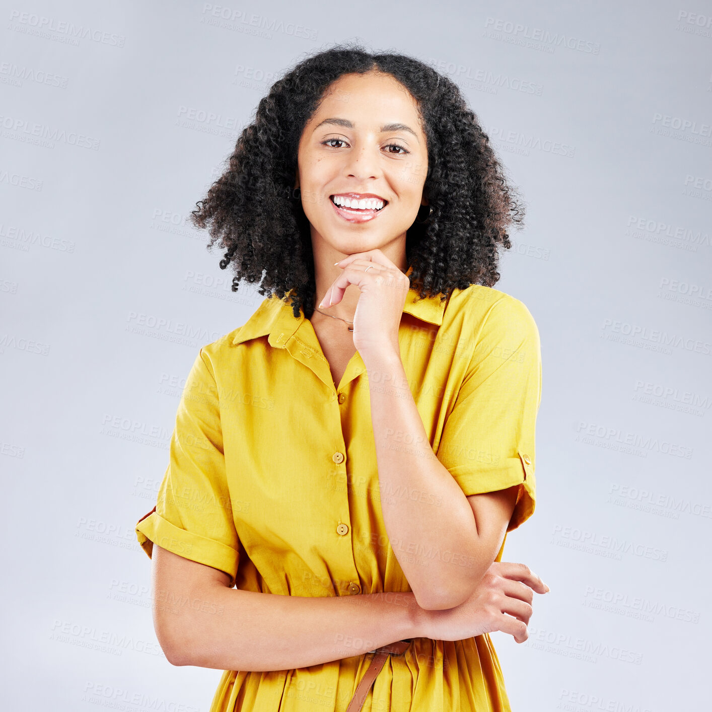 Buy stock photo Portrait, fashion and smile with a model woman in studio on a gray background for trendy style. Yellow, beauty and a happy or confident young female person with an afro posing in a clothes outfit