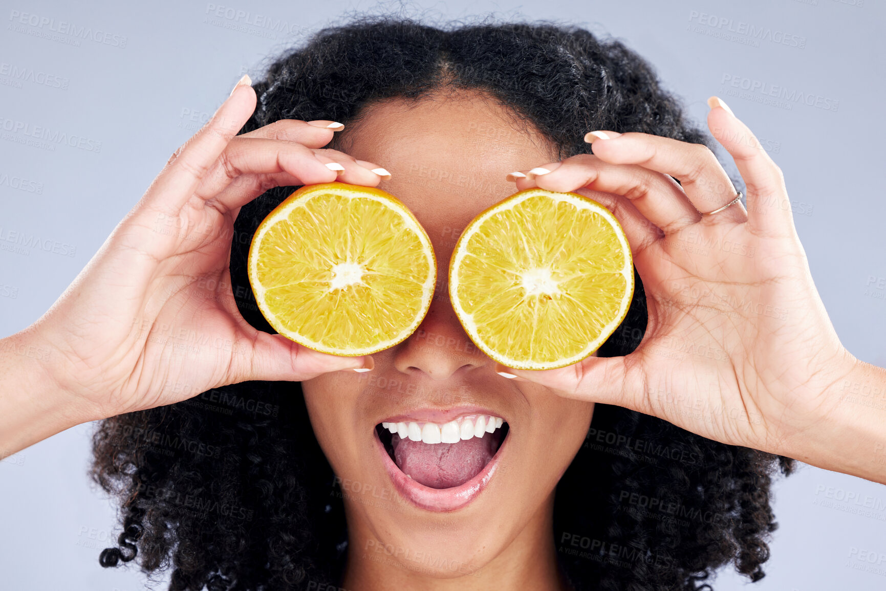 Buy stock photo Woman, lemon eyes and wellness in studio with comic smile, health and skincare with nutrition by background. Girl, model and fruit for diet, cleaning or cosmetics with beauty, self care and emoji