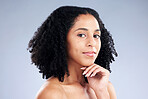 Portrait, skincare and aesthetic with a model black woman in studio on a gray background for beauty. Face, natural and hair with a young female person at the salon for luxury wellness or treatment