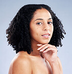 Portrait, beauty and facial with a model black woman in studio on a gray background for skincare. Face, aesthetic or confident with a young female person at the salon for luxury wellness or treatment