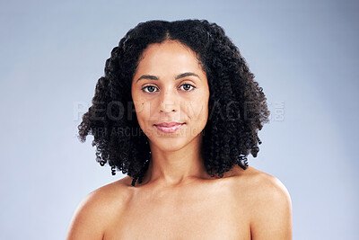 Buy stock photo Portrait, beauty and confident with African model woman in studio on a gray background for skincare. Face, aesthetic and natural with a young female person at the salon for serious skin wellness