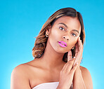 Woman, portrait and beauty with pink lipstick, skincare and makeup with cosmetics on blue background. Color, bold and wellness with self care, skin glow and cosmetology, female model in a studio
