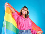 Lgbtq flag, freedom and woman with support, pride and transgender right on a blue studio background. Female person, lesbian or model with symbol for queer community, equality or celebration with hope