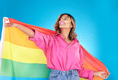 Buy stock photo Lgbtq, lesbian and woman with support, pride flag or equality on blue studio background. Female person, rainbow or model with symbol for queer community,  transgender rights or freedom with self love