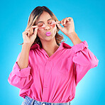 Fashion sunglasses, makeup and woman in studio isolated on a blue background. Cosmetics, glasses and Indian model with lipstick, style and casual summer clothes for aesthetic, gen z and eyes closed