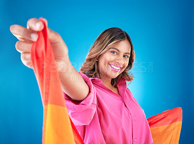 Buy stock photo LGBTQ woman, flag and studio portrait with beauty, peace and freedom with pride for inclusion by blue background. Lesbian girl, student or model with smile for protest, icon or advocate for sexuality