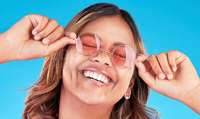 Buy stock photo Fashion sunglasses, face and happy woman in studio isolated on a blue background. Smile, glasses and Indian model with style, casual shades and positive mindset for aesthetic, gen z and eyes closed