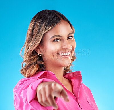 Buy stock photo Pointing finger, smile and portrait of woman in studio to select, advertising or choice. Face of happy model person with hand or emoji for accountability, decision or choosing you on blue background