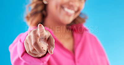 Buy stock photo Pointing, finger choice and a woman on a blue background for recruitment, hiring and motivation. Smile, offer and hand of a person or girl with a decision isolated on a studio backdrop for promo