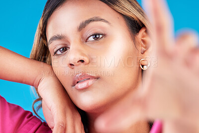 Buy stock photo Selfie, beauty portrait and woman with makeup for social media, cosmetics review and profile picture in studio. African woman or model face photography for skincare and dermatology on blue background