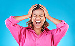 Angry, frustrated and a shouting woman on a blue background with a mental health problem. Stress, bipolar and a young screaming Indian girl with a fail or mistake isolated on a studio backdrop