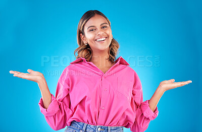 Buy stock photo Space, choice and presentation with portrait of woman in studio for decision, show and information. Offer, advertising and deal with face of person on blue background for thinking, option and mockup