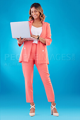 Buy stock photo Laptop, fashion and business woman with online marketing, social media planning or copywriting research in studio. E commerce, creative suit and full body of person on a computer and blue background