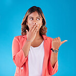 Shock, pointing and business woman in studio with gesture for advertising, marketing and promotion. Mockup, surprise and female person with omg face for deal, discount and sale on blue background