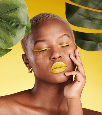 Buy stock photo Calm black woman, makeup and natural beauty in relax for cosmetics with leafs against a yellow studio background. Face of African female person with eyes closed in satisfaction for facial treatment