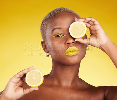 Buy stock photo Black woman, portrait and lemon for vitamin C or natural beauty against a yellow studio background. African female person with organic citrus fruit for diet, detox or facial cosmetics and makeup