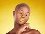 Face, makeup and lipstick with a black woman in studio on a yellow background for creative, beauty or cosmetics. Gold, color and eyeshadow on young model with eyes closed for fashion or aesthetic