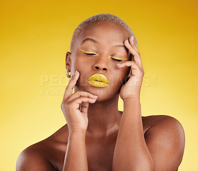 Buy stock photo Creative, makeup and face with lipstick or black woman in studio on a yellow background for art, beauty or cosmetics. Gold, color and eyeshadow on calm model with eyes closed for fashion or aesthetic
