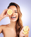Vitamin c, lemon and eye of woman with beauty, natural or organic wellness isolated in a brown studio background. Excited, happy and healthy young female person with citrus for skincare or detox