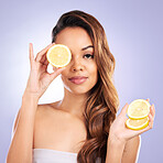 Vitamin c, lemon and eye of woman with healthy, natural or organic beauty isolated in a brown studio background. Excited, happy and portrait of young female person with citrus for skincare or detox