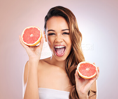 Buy stock photo Citrus, grapefruit and portrait of woman with healthy, natural or organic beauty isolated in a brown studio background. Excited, happy and young female person with vitamin c for skincare or detox