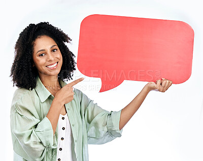 Buy stock photo Woman, studio portrait and point at speech bubble with smile for promo, mockup or space by white background. Isolated African girl, happy student and sign for poster, paper billboard or social media