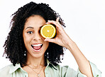 Vitamin c, lemon and eye or portrait of woman with fashion for organic wellness isolated in a studio white background. Diet, fruit and happy or excited young person with crazy citrus energy and detox