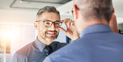 Buy stock photo Glasses, choice and senior man, mirror and vision with eyewear in clinic, prescription lens with designer frame. Eyesight, eye care and optometry, healthcare and male person with spectacles decision