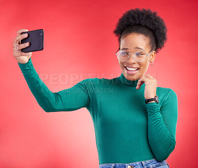 Buy stock photo Selfie, smile and black woman in studio for profile picture, post or message on red background. Happy, photo and African female with memory on social media, dating app or online communication update