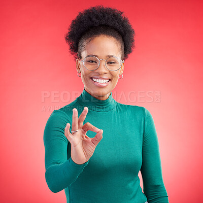 Buy stock photo Perfect, hand and happy black woman portrait in studio for support, review or success, vote or agree on red background. Smile, face and African person with okay, emoji or yes, thank you or feedback