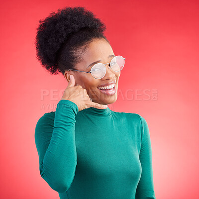 Buy stock photo Call me, woman and portrait in studio with model and phone hand gesture for talk. Red background, happy female person and flirting with speaking, mobile and contact icon and sign with a smile 