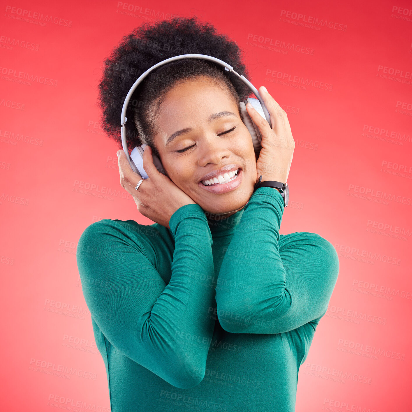 Buy stock photo Happy black woman, headphones and listening to music for audio streaming against a red studio background. Calm African female person smile in relax enjoying sound track or entertainment on headset